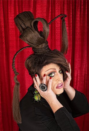 simsearch:400-07261849,k - Frightened drag queen with large beetle earrings and ponytails Fotografie stock - Microstock e Abbonamento, Codice: 400-07261831