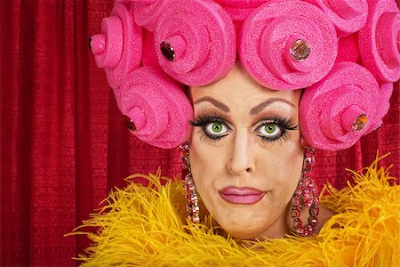 simsearch:400-07261849,k - Doubting drag queen with wig frowning in theater Fotografie stock - Microstock e Abbonamento, Codice: 400-07261850