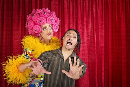 simsearch:400-07261849,k - Big drag queen trying to kiss a scared man Fotografie stock - Microstock e Abbonamento, Codice: 400-07263309