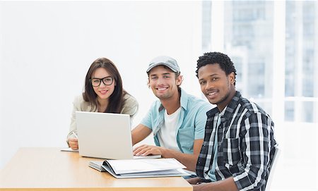 Group of casual artists working at desk in the creative office Stock Photo - Budget Royalty-Free & Subscription, Code: 400-07274009