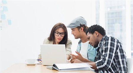 Group of casual artists working at desk in the creative office Stock Photo - Budget Royalty-Free & Subscription, Code: 400-07274010