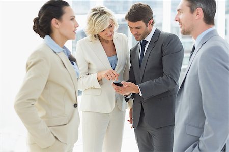 simsearch:400-07274497,k - Business colleagues in discussion during break at a bright office Stock Photo - Budget Royalty-Free & Subscription, Code: 400-07274484