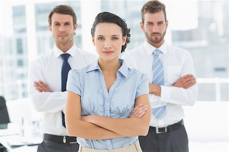 simsearch:400-07274414,k - Portrait of a confident business team standing with arms crossed in a bright office Photographie de stock - Aubaine LD & Abonnement, Code: 400-07274507