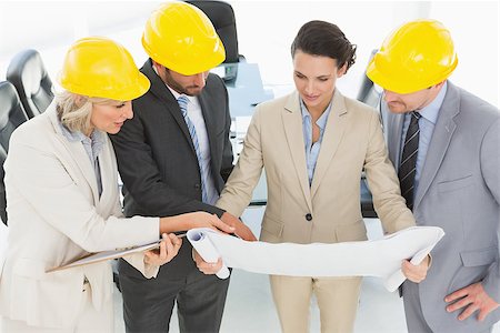 simsearch:400-07274497,k - Engineer coworkers discussing a project in the office Stock Photo - Budget Royalty-Free & Subscription, Code: 400-07274555
