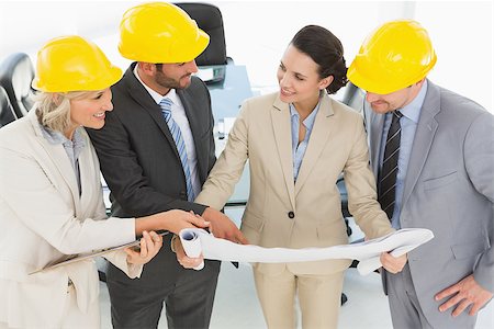 simsearch:400-07274497,k - Engineer coworkers discussing a project in the office Stock Photo - Budget Royalty-Free & Subscription, Code: 400-07274556