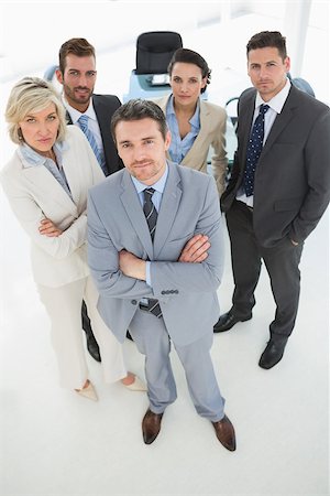 simsearch:400-07275828,k - Portrait of a confident business team standing in a bright office Photographie de stock - Aubaine LD & Abonnement, Code: 400-07274551
