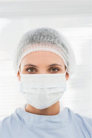 doctor with cap and mask - Closeup portrait of a female surgeon wearing surgical cap and mask in the hospital Stock Photo - Budget Royalty-Free & Subscription, Code: 400-07274894