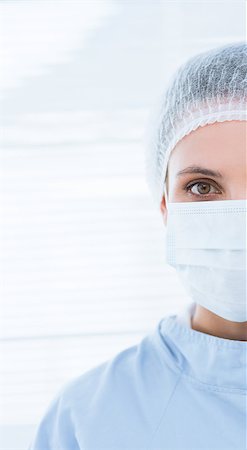 doctor with cap and mask - Closeup portrait of a female surgeon wearing surgical cap and mask in the hospital Stock Photo - Budget Royalty-Free & Subscription, Code: 400-07274895