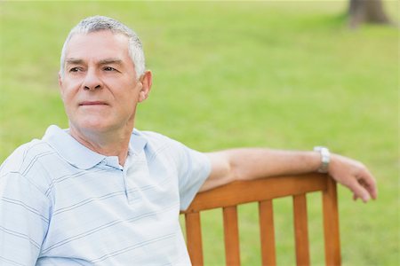 simsearch:400-06520162,k - Portrait of a smiling senior man relaxing at the park Stock Photo - Budget Royalty-Free & Subscription, Code: 400-07274907