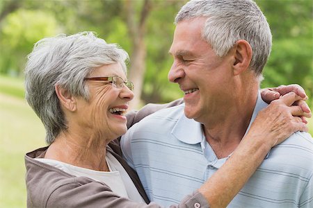 simsearch:400-07275058,k - Closeup of a happy senior woman embracing man at the park Fotografie stock - Microstock e Abbonamento, Codice: 400-07274964