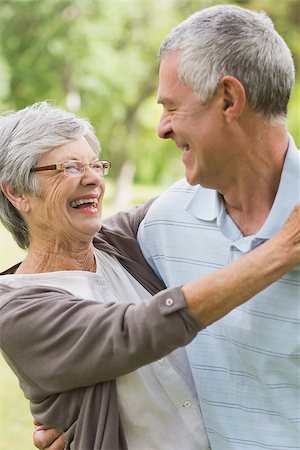simsearch:400-07275058,k - Closeup of a happy senior woman embracing man at the park Fotografie stock - Microstock e Abbonamento, Codice: 400-07274965