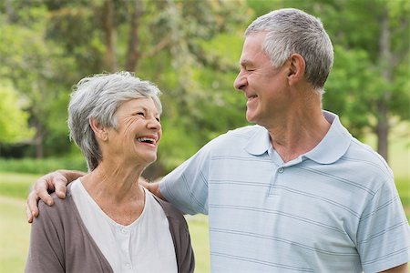 simsearch:400-07274982,k - Happy senior woman and man with arms around at the park Stock Photo - Budget Royalty-Free & Subscription, Code: 400-07274963