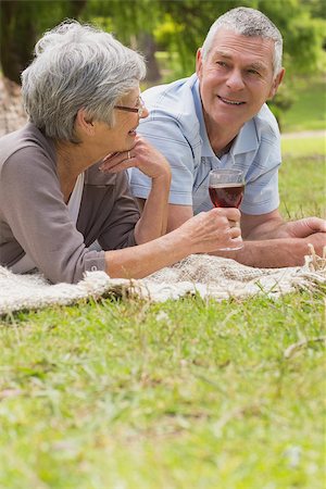 simsearch:400-07274981,k - Closeup of a senior woman and man lying at the park Stock Photo - Budget Royalty-Free & Subscription, Code: 400-07274989