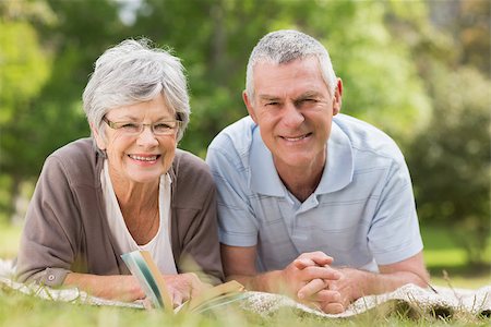 simsearch:400-07274981,k - Portrait of a smiling relaxed senior couple lying in the park Stock Photo - Budget Royalty-Free & Subscription, Code: 400-07275007