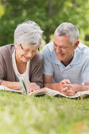 simsearch:400-07274981,k - Portrait of a smiling relaxed senior couple lying in the park Stock Photo - Budget Royalty-Free & Subscription, Code: 400-07275009