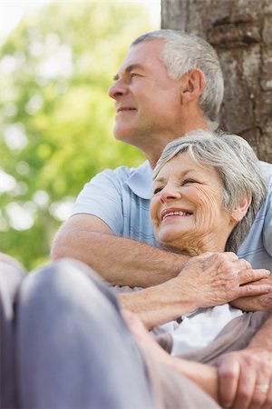 simsearch:400-07274982,k - Portrait of a happy senior man embracing woman from behind at the park Stock Photo - Budget Royalty-Free & Subscription, Code: 400-07275055