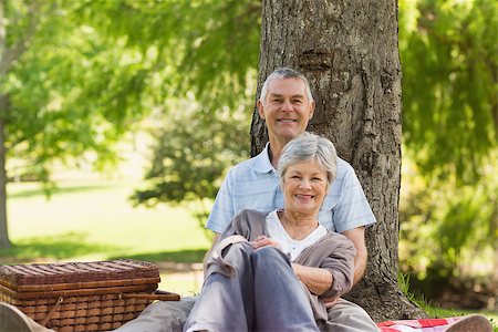 simsearch:400-07274981,k - Happy senior man embracing woman from behind at the park Stock Photo - Budget Royalty-Free & Subscription, Code: 400-07275051