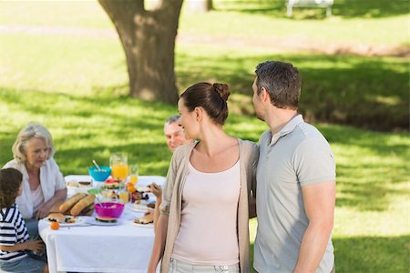 Couple with extended family dining background at outdoor table Stock Photo - Budget Royalty-Free & Subscription, Code: 400-07275236