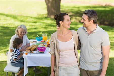 Couple with extended family dining background at outdoor table Stock Photo - Budget Royalty-Free & Subscription, Code: 400-07275237