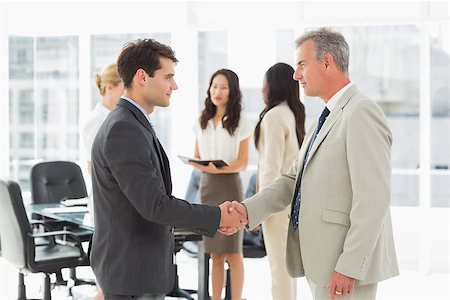simsearch:400-07275394,k - Businessmen meeting and shaking hands in the office Stock Photo - Budget Royalty-Free & Subscription, Code: 400-07275298