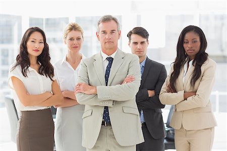 simsearch:400-07275828,k - Business team looking at camera with arms crossed in the office Photographie de stock - Aubaine LD & Abonnement, Code: 400-07275305