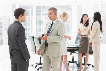 simsearch:400-07275394,k - Business people speaking together in conference room in the office Stock Photo - Budget Royalty-Free & Subscription, Code: 400-07275300