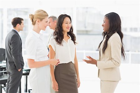 simsearch:400-07275394,k - Businesswomen speaking together in conference room in the office Stock Photo - Budget Royalty-Free & Subscription, Code: 400-07275301