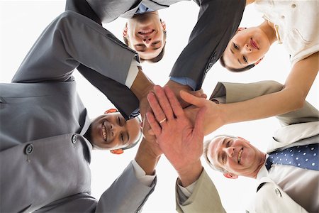 simsearch:400-07274497,k - Business team looking down at the camera with hands together in the office Stock Photo - Budget Royalty-Free & Subscription, Code: 400-07275335