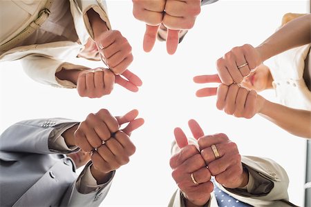 simsearch:400-07275394,k - Business team looking down at the camera showing thumbs up in the office Stock Photo - Budget Royalty-Free & Subscription, Code: 400-07275338