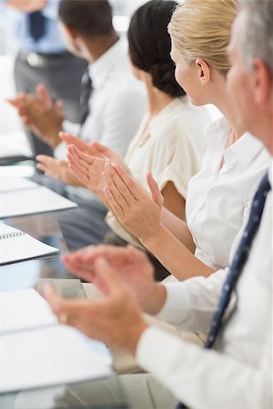 simsearch:400-07275394,k - Business people clapping colleague at a meeting in the office Stock Photo - Budget Royalty-Free & Subscription, Code: 400-07275398