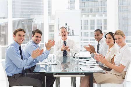 simsearch:400-07275394,k - Business people clapping the camera at a meeting in the office Stock Photo - Budget Royalty-Free & Subscription, Code: 400-07275399