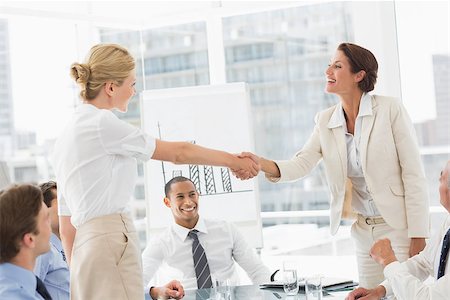 simsearch:400-07275394,k - Businesswomen making a deal at a meeting in the office Stock Photo - Budget Royalty-Free & Subscription, Code: 400-07275418