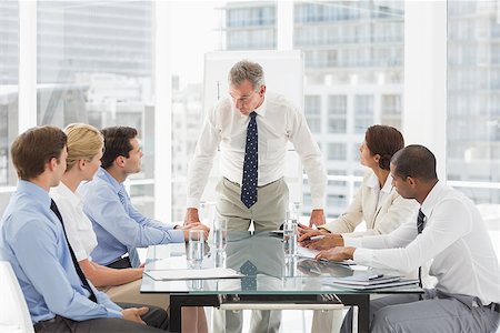 simsearch:400-07275394,k - Stern businessman looking down at his staff during a meeting in the office Stock Photo - Budget Royalty-Free & Subscription, Code: 400-07275420