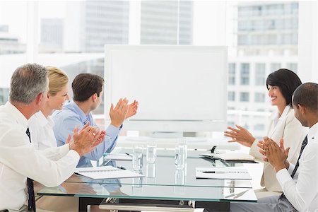 simsearch:400-07275394,k - Business people clapping at blank whiteboard in conference room in the office Stock Photo - Budget Royalty-Free & Subscription, Code: 400-07275441