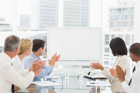 simsearch:400-07275394,k - Business people applauding blank whiteboard in conference room in the office Stock Photo - Budget Royalty-Free & Subscription, Code: 400-07275442