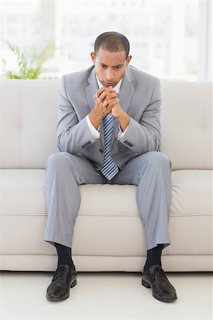 simsearch:400-07833287,k - Anxious businessman sitting on couch in the office Stock Photo - Budget Royalty-Free & Subscription, Code: 400-07275566