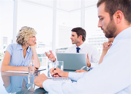 simsearch:400-07274497,k - Smartly dressed young executives sitting around conference table in office Stock Photo - Budget Royalty-Free & Subscription, Code: 400-07275913