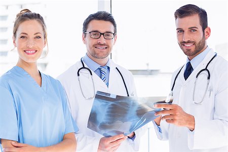 simsearch:400-07778150,k - Portrait of two male doctors and surgeon with xray report at the medical office Stock Photo - Budget Royalty-Free & Subscription, Code: 400-07275992