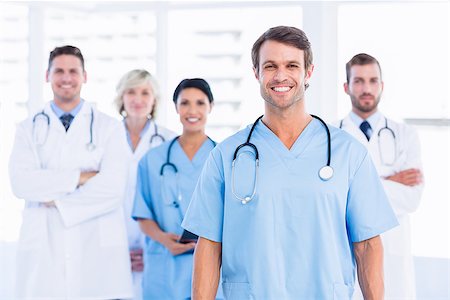 simsearch:6109-06196095,k - Portrait of confident happy group of doctors standing at the medical office Stockbilder - Microstock & Abonnement, Bildnummer: 400-07276028