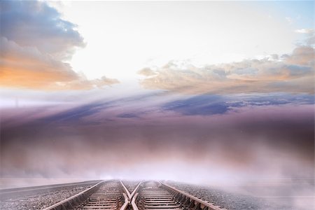 simsearch:400-07446838,k - Train tracks leading to misty horizon Photographie de stock - Aubaine LD & Abonnement, Code: 400-07277215