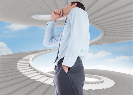 person on winding stairs - Thoughtful businessman with hand on chin against spiral staircase in the sky Stock Photo - Budget Royalty-Free & Subscription, Code: 400-07277577