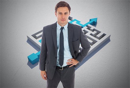 serious hip businessman - Serious businessman standing with hand on hip against blue arrow solving puzzle Stock Photo - Budget Royalty-Free & Subscription, Code: 400-07277901