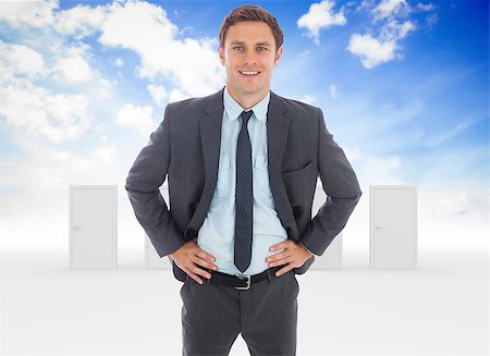 simsearch:400-08380053,k - Cheerful businessman standing with hands on hips against opening door in sky Stockbilder - Microstock & Abonnement, Bildnummer: 400-07278095