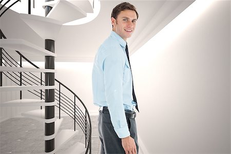 person on winding stairs - Happy businessman standing with hand in pocket against digitally generated room with winding staircase Stock Photo - Budget Royalty-Free & Subscription, Code: 400-07278112