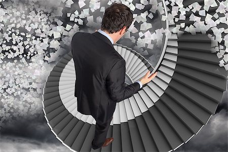 person on winding stairs - Stressed businessman gesturing against winding staircase in the sky with flying papers Stock Photo - Budget Royalty-Free & Subscription, Code: 400-07278156