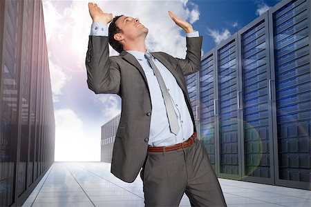 simsearch:400-07448129,k - Businessman standing with arms pressing up against server hallway in the sky Stock Photo - Budget Royalty-Free & Subscription, Code: 400-07278163