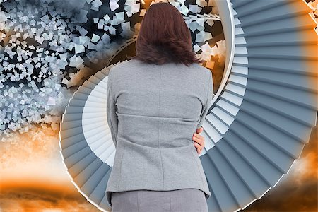 person on winding stairs - Businesswoman against winding staircase in the sky with flying papers Stock Photo - Budget Royalty-Free & Subscription, Code: 400-07278191