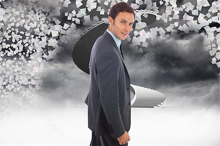person on winding stairs - Cheerful handsome businessman standing  against winding staircase in the sky with flying papers Stock Photo - Budget Royalty-Free & Subscription, Code: 400-07278308