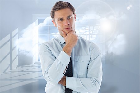 Thinking businessman with hand on chin against room with holographic cloud Stock Photo - Budget Royalty-Free & Subscription, Code: 400-07278314