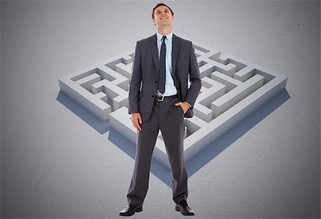 simsearch:400-07446676,k - Happy businessman with hand in pocket against maze puzzle Foto de stock - Super Valor sin royalties y Suscripción, Código: 400-07278342